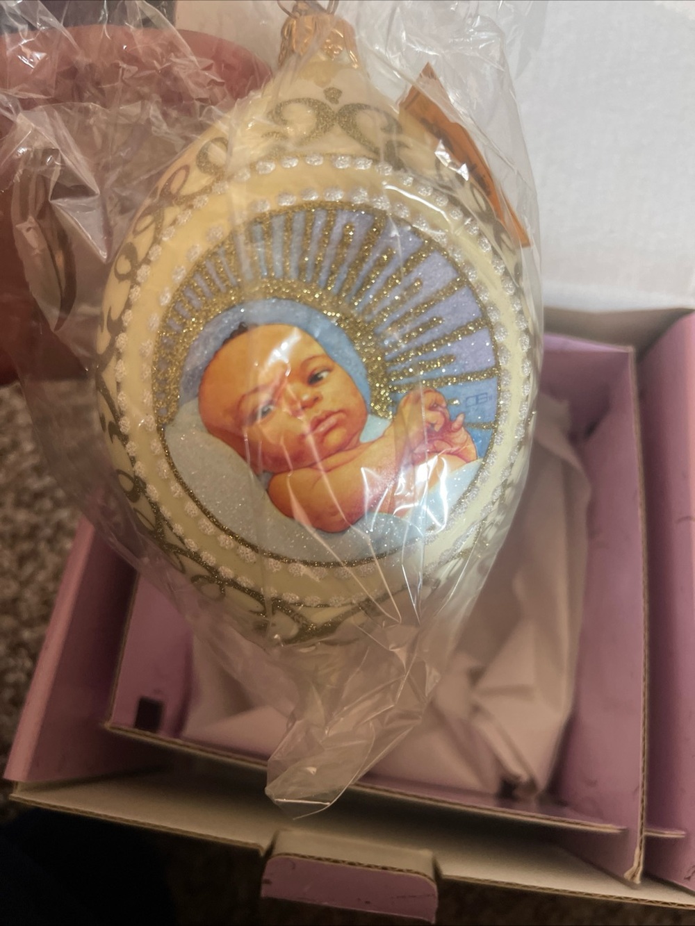 Hand-Painted Ivory Baby Ornament with Gold Accents